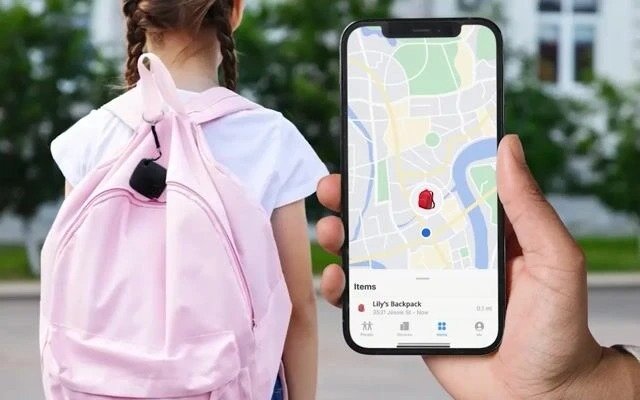 Traveler with a backpack checking a phone for an item's location